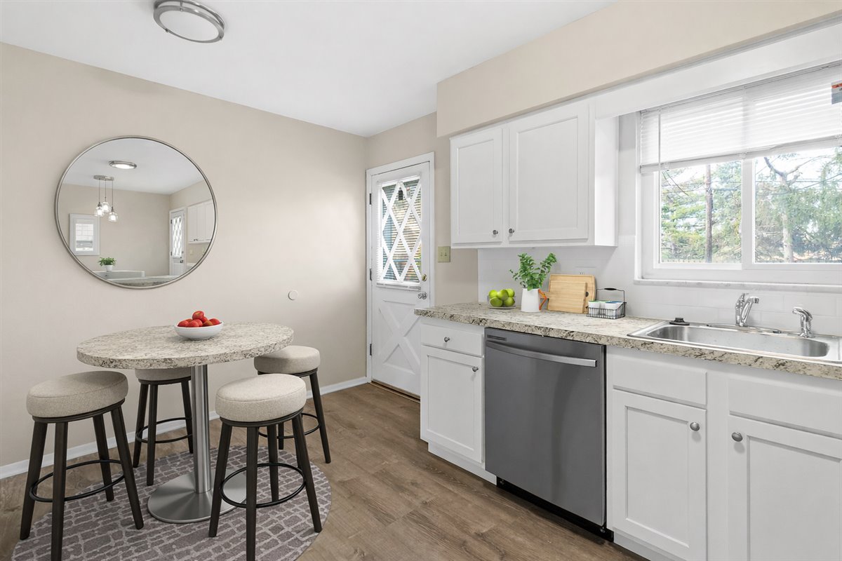 Modern kitchen with stainless steel appliances and updated finishes.